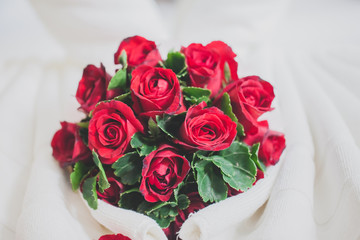 honeymoon bed look like heart shape with rose petals for honeymoon lover.