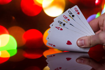 Four of a kind poker cards combination on blurred background casino luck fortune card game