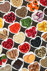 Super food nutrition for a healthy heart high in antioxidants, anthocyanins, fibre, vitamins and minerals with fruit, vegetables, pulses, fish, seeds, nuts, cereals and herbs used in herbal medicine.