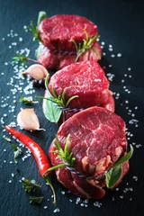 Rolgordijnen Raw beef fillet steaks mignon on dark background © Alexander Raths