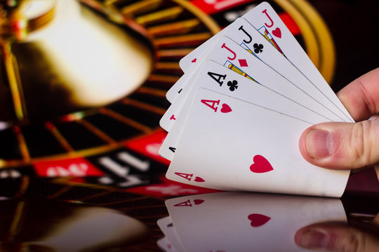 Full house poker cards combination on blurred background casino luck fortune card game