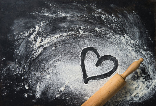 Baking background with the rolling pin, heart shape and flour - Powered by Adobe