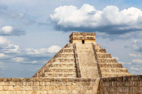 Temple of Kukulcan or the Castle and stone wall in foreground, the center of the Chichen Itza maya archaeological site, Yucatan, Mexico
