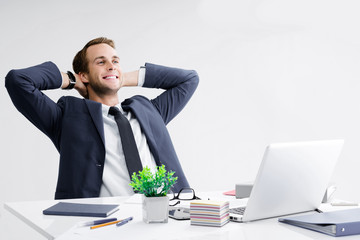 Relaxing or dreaming businessman at office