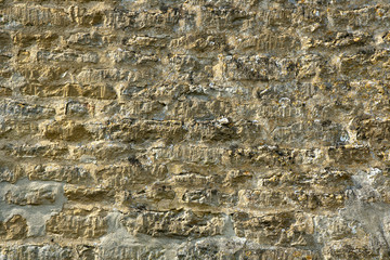 Old lichen covered  limestone wall background texture