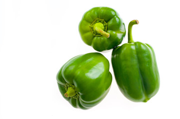 Top view on green peppers isolated on white background