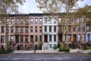 Tuinposter a view of a row of historic brownstone buildings in an iconic neighborhood of Manhattan, New York City © goodmanphoto