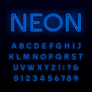 Blue neon tube alphabet font. Neon color shiny letters, numbers and symbols. Stock vector typeface for any typography design.