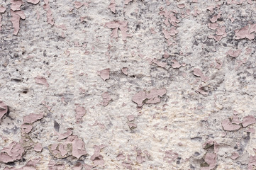 Elements Pink paint coating with cracks on a dirty gray stone. Peeling pink paint Grunge