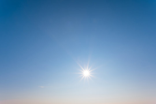 low winter sparkle sun on a blue sky background