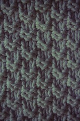 The texture of a knitted woolen fabric blue. Background for web site or mobile devices.