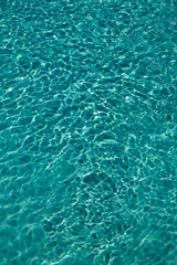 Fototapeta premium Textured light effect on the surface ripples of an outdoor swimming pool