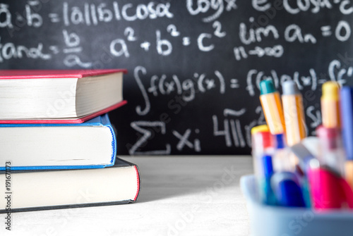 school supplies in classroom blackboard or chalkboard in class