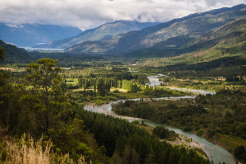 Landscape of Blue river, valley and forest in El Bolson, argentinian Patagonia - obrazy, fototapety, plakaty