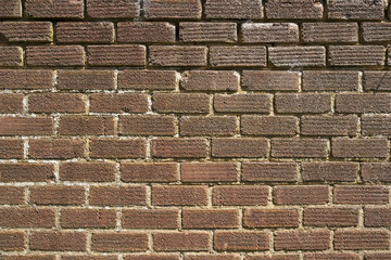 An old weathered, damaged, brick wall needs repairs. full frame. Construction full frame texture background.