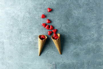 Valentine day candy with red hearts and cones