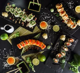 Fotobehang sushi on the black background © Maksim Shebeko