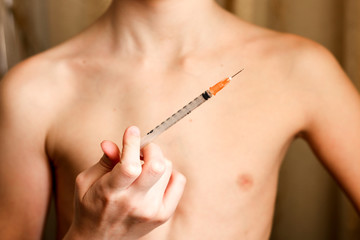 syringe in a child's hand