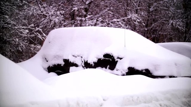 Cars covered with snow in a residential area of Moscow.