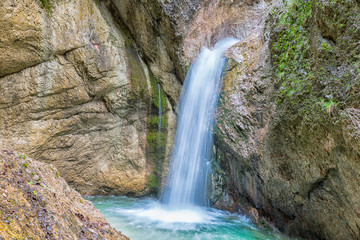Obraz premium Waterfall with bare rocks in Almbach gorge near Berchtesgaden in Germany