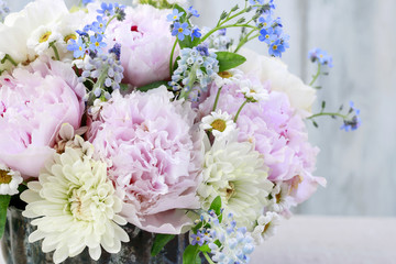 Floral arrangement with pink peonies