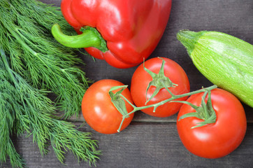 Bunch of fresh vegetables. Tomatoes, zucchini, cucumbers, bell peppers and dill.