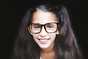 Image of a beautiful African young girl wearing glasses.