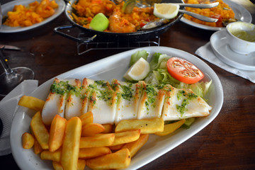 The grilled squid dish is of the Mediterranean cuisine.