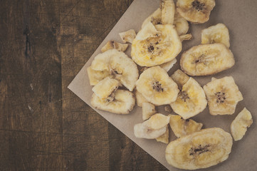 Slices of dried banana, top view flat lay