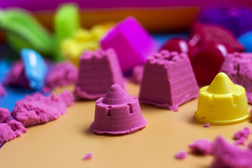 Pink kinetic sand, educational game for children. The development of motor skills in boys and girls