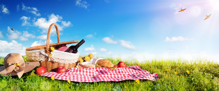 Picnic - Basket With Bread And Wine On Meadow

