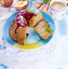A bouquet of fresh tulips. Sweet home cupcake with sugar. Coffee in a cup. Apples on the table. Free space for text or a postcard. Sweet gift. Good morning