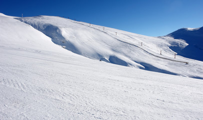 View of the ski slopes in the resort of Sinaia on a sunny day.