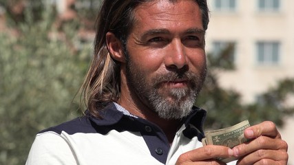 Handsome Spanish Male Holding Money