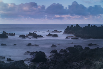 Long exposure coastal scene with sea stacks in Hawaii