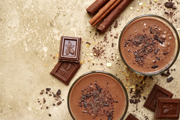 Chocolate banana smoothie with cinnamon.Top view with copy space.