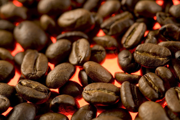 Glowing backlit coffee beans close up texture