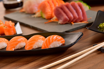Nigiri Sushi and Sashimis on restaurant table