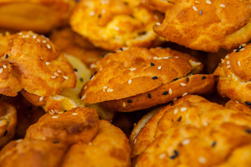 Batch of Sliced Brioche Buns with Sesame Seeds