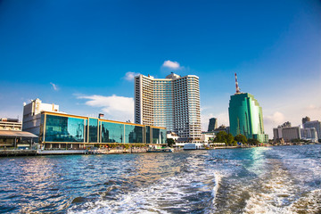 Business district cityscape from Chao Phraya Rive, Bangkok Thailand.