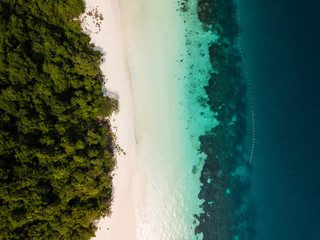 Aerial view from a drone of beautiful Madame beach at Nyaung Oo Phee island on sunny day in Myanmar.