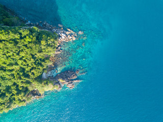 Aerial view from a drone of beautiful Nyaung Oo Phee island on sunny day in Myanmar.