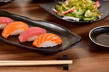 Salmon and Tuna Nigiri Sushis on restaurant table