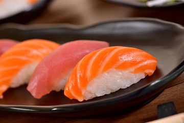 Salmon and Tuna Nigiri Sushis on restaurant table