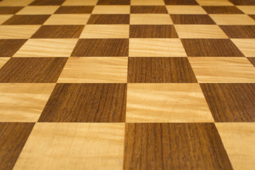 Old wooden chess board low level view with shallow depth of field