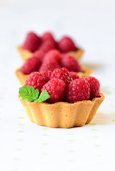 Mini tarts with raspberries fruits