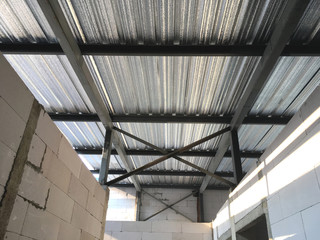 Metal sheet roof with heat insulation on  steel structure - 191697344