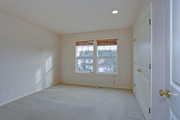 Empty bedroom with cream paint color walls