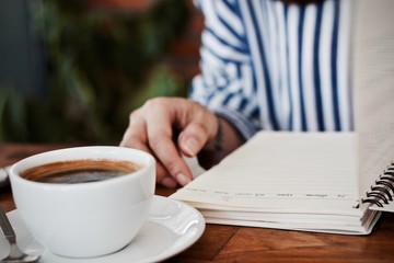 Coffee cup hot in the morning and working at cafe