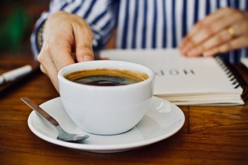 Coffee cup hot in the morning and working at cafe